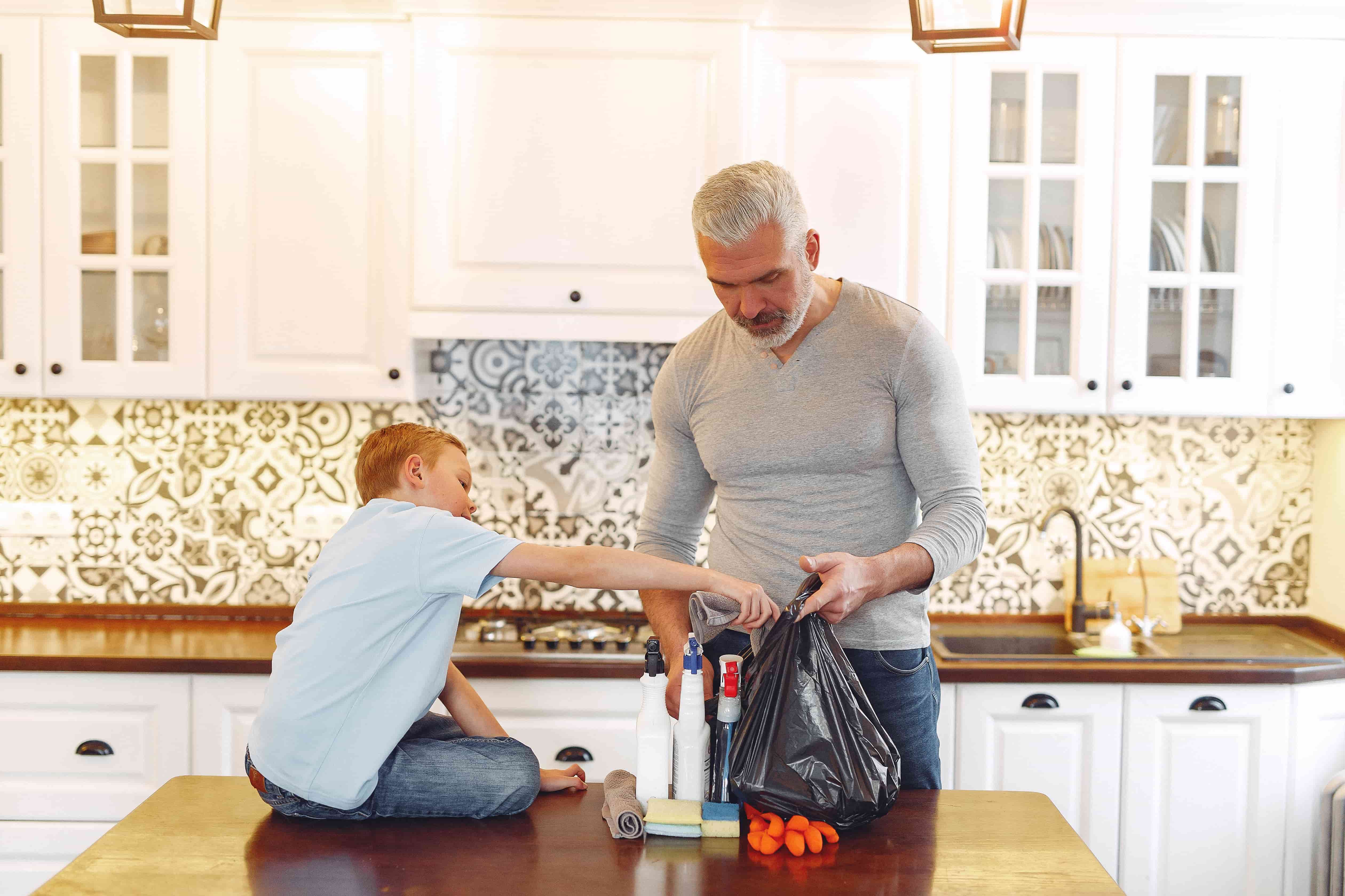 A boy with father on kitchen